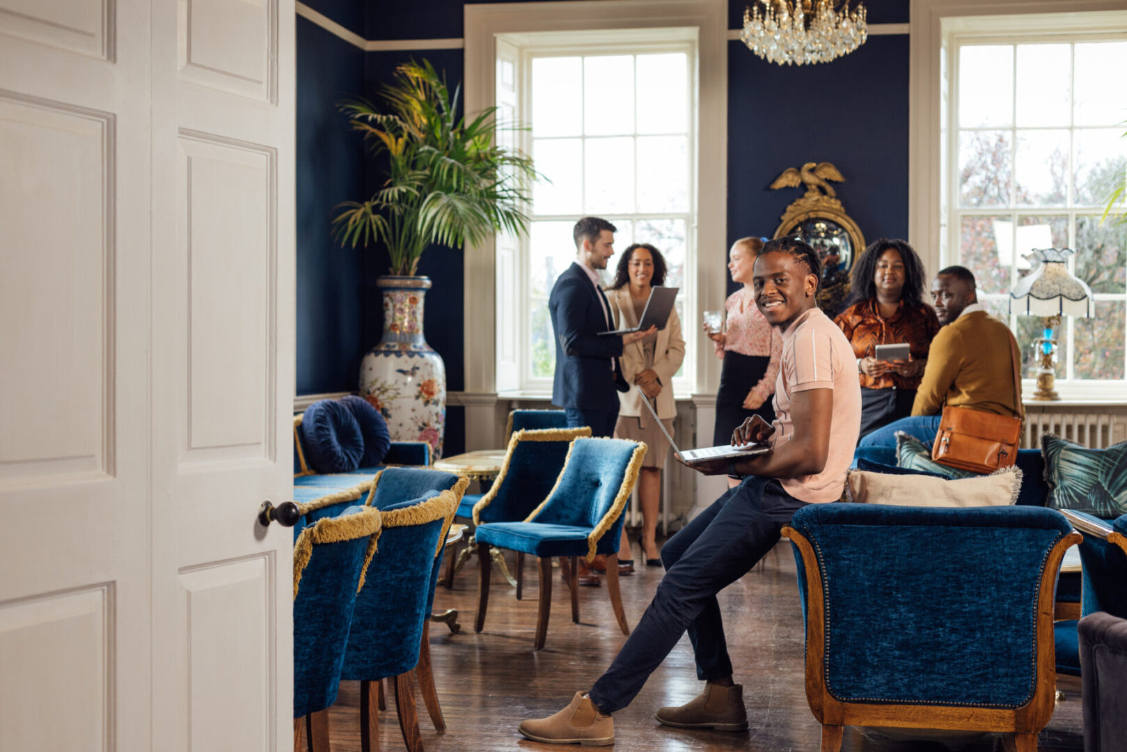 Group of people in a stylish room.