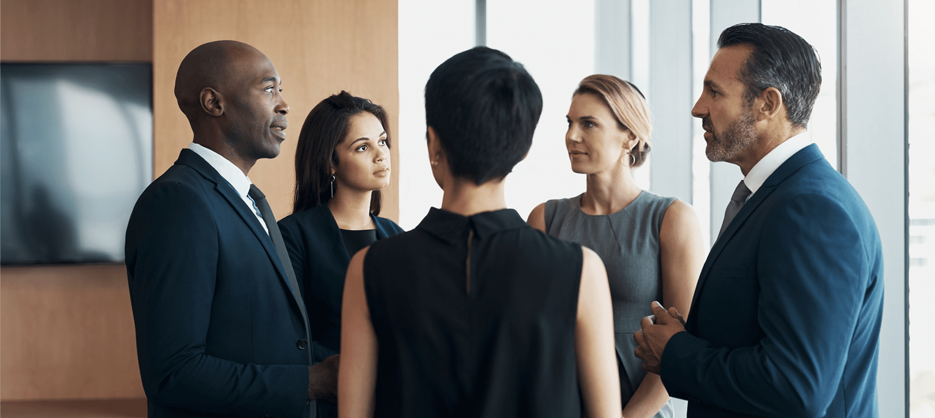 Business meeting with diverse professionals in discussion.